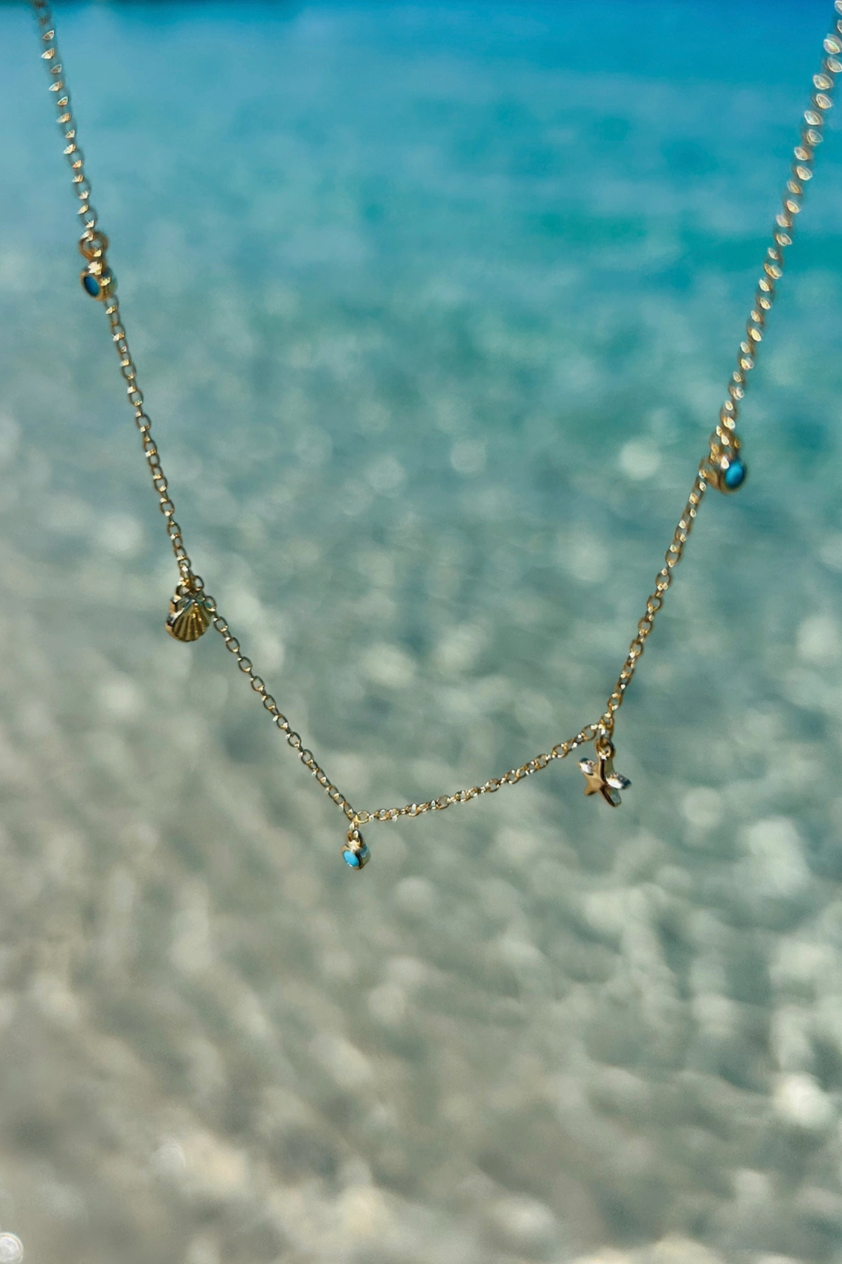 faux turquoise necklace. gold plated necklace