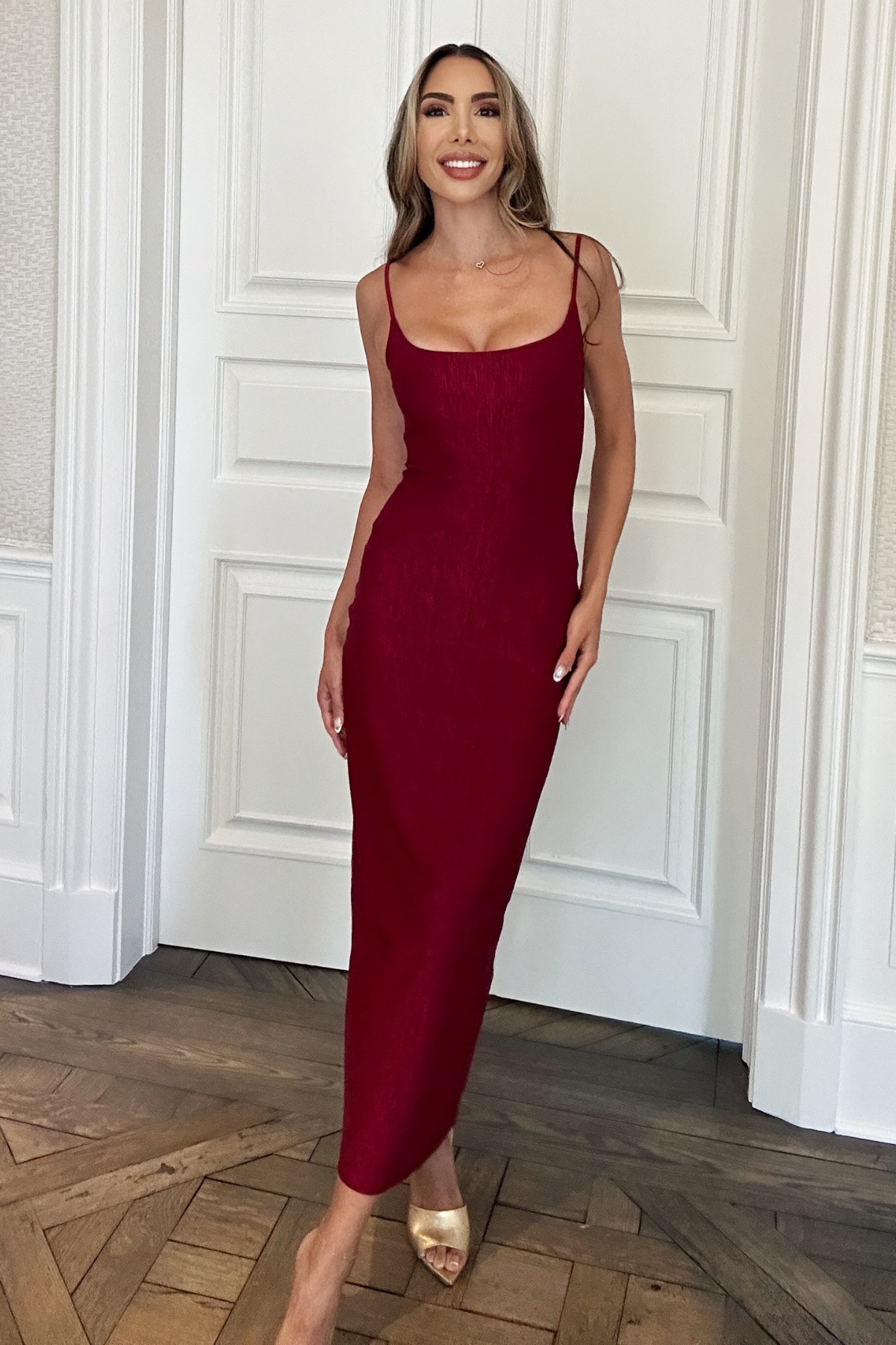 burgundy long fitted holiday dress. criss cross back.