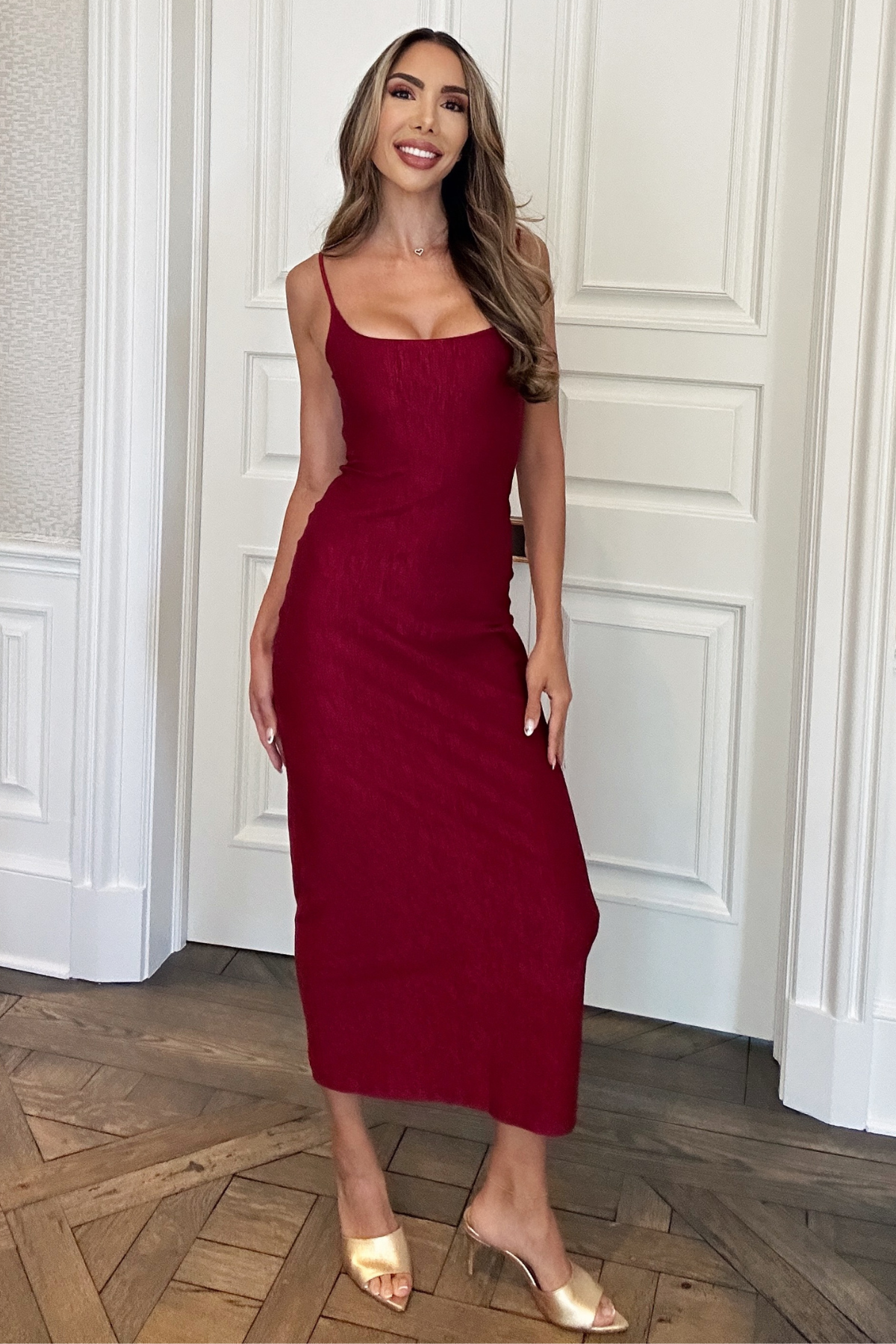 burgundy long fitted holiday dress. criss cross back.